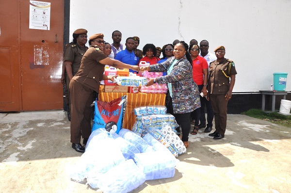 CSP Mandy Mensah (left) receiving the items from the Ho District GNATLAS Coordinator, Benedicta Tawiah, while other members look on. Ho District GNATLAS donates to Ho Female Prison